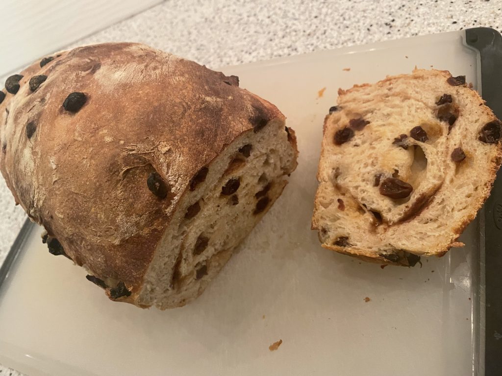 Sourdough Cinnamon Raisin Bread with a slice cut